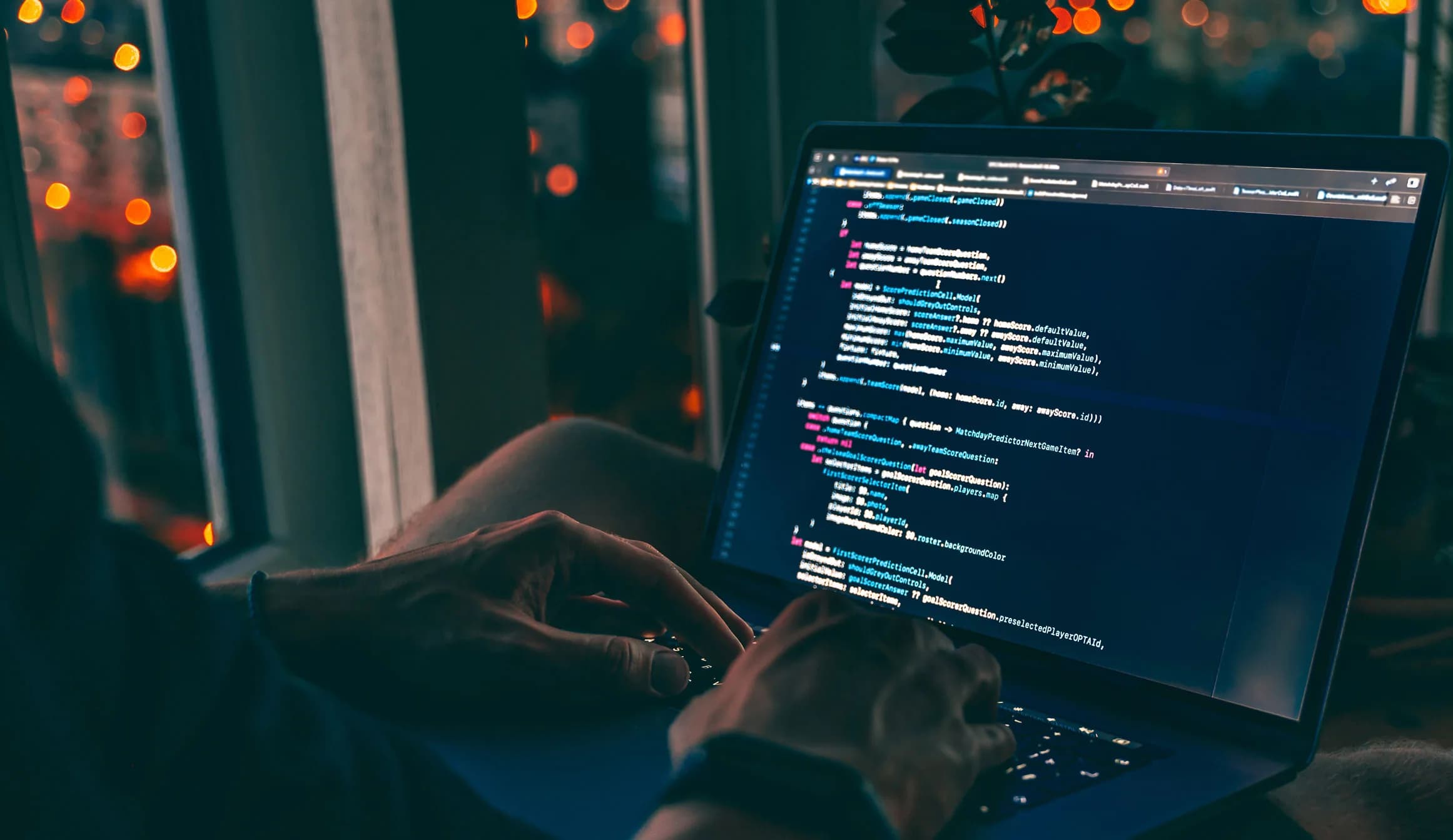 hands on a laptop