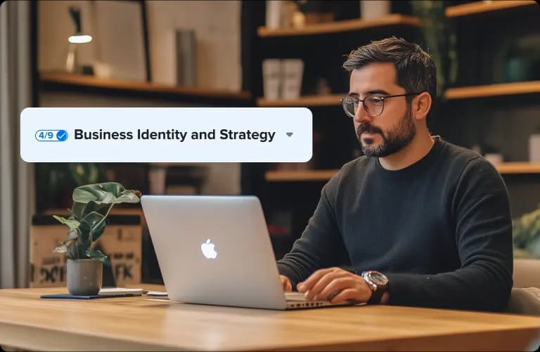 Man sitting behind desk working on laptop